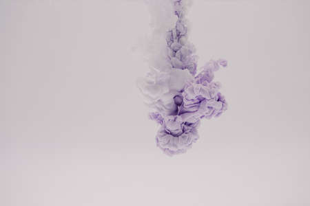 mauve smoke on a white backgroundの写真素材