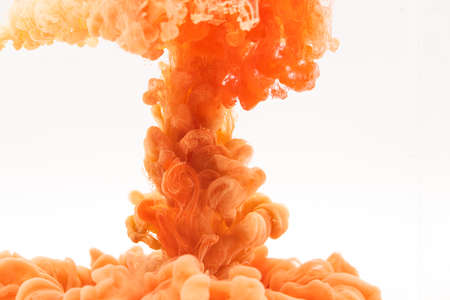 orange red smoke on white backgroundの写真素材