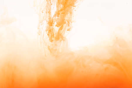orange red smoke on white backgroundの写真素材