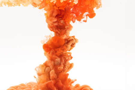 orange red smoke on white backgroundの写真素材