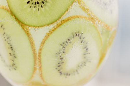 Kiwi slices and air bubblesの写真素材