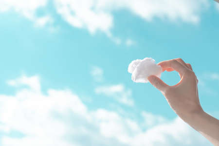 hand holding a cloudの写真素材