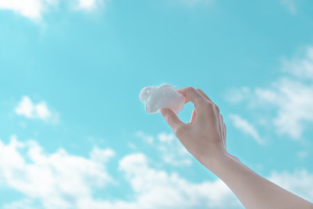 hand holding a cloudの写真素材
