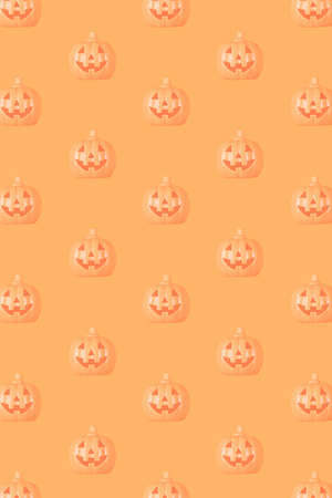 Halloween pumpkin pattern on orange backgroundの写真素材