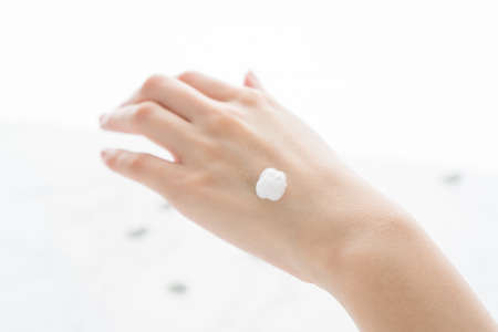 cream on the back of the handの写真素材