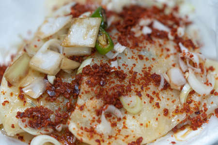 Flat dumplings topped with seasoningの写真素材