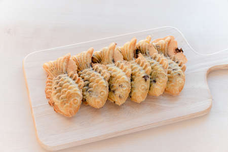 Korean winter food Bungeoppang served on a wooden plateの写真素材