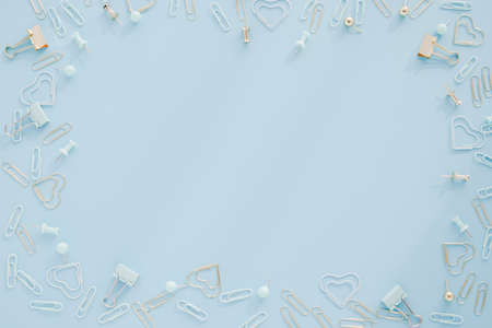 Clip and pushpin design on sky blue background