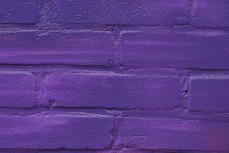 Violet brick wall as backgroundの写真素材