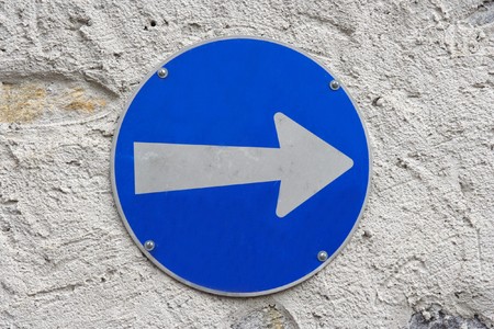 Traffic road sign isolated on wallの写真素材