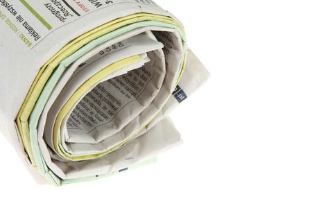 Roll of newspapers, isolated on white backgroundの写真素材
