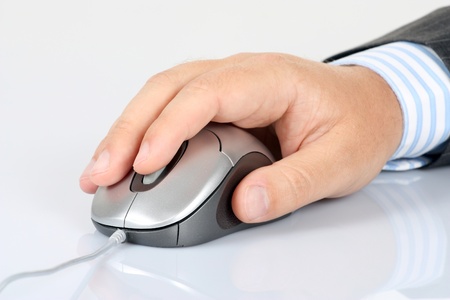 Computer mouse and men's handの写真素材