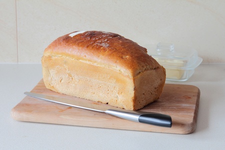 stock photo : bread with knife on kitchen worktops