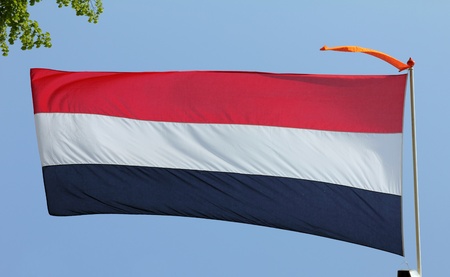 Dutch flag on blue sky の写真素材