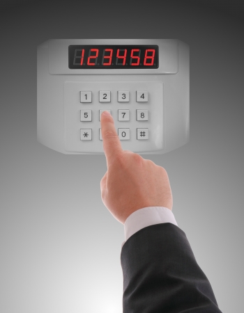 Hand dialling on keypad using touch screen interfaceの写真素材