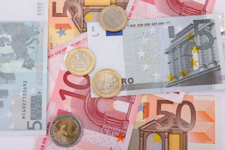 Euro banknotes with coins, financial backgroundの写真素材