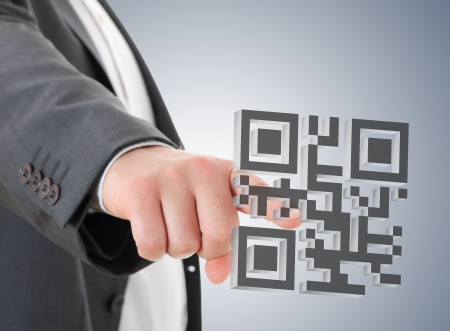Man press on QR codeの写真素材