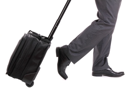 A business traveler with suitcase on whiteの写真素材