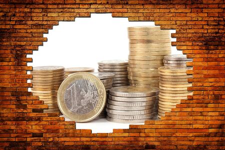money for a hole in the brick wallの写真素材