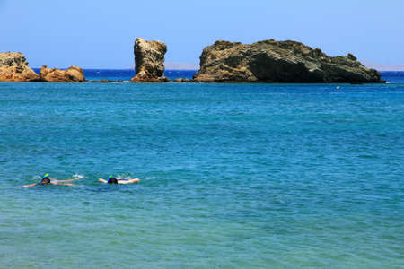  Snorkeling, blue sea with rocks on Crete, Greece