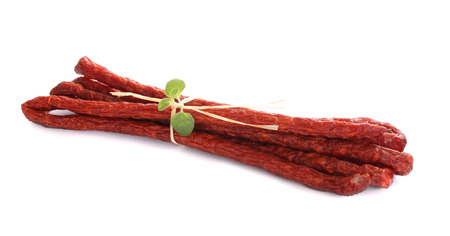 sausages decorated with basil and straw tapeの写真素材