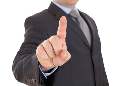 Business man pressing an imaginary button on white backgroundの写真素材