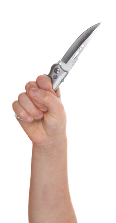 hand holding knife isolated on white backgroundの写真素材