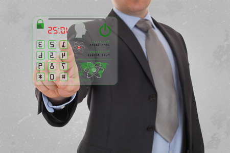 Man pressing the security code in office.の写真素材