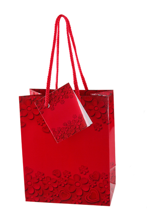 Vibrant red blank paper shopping bag with hearts,  on white background isolated .の写真素材