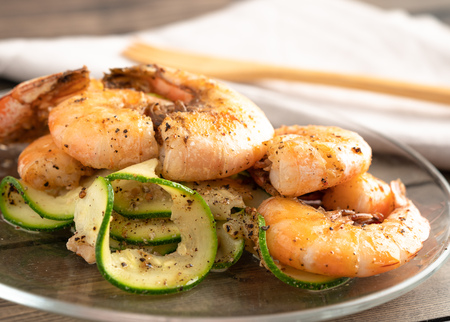 Grilled shrimp and zucchini salad plated and servedの写真素材