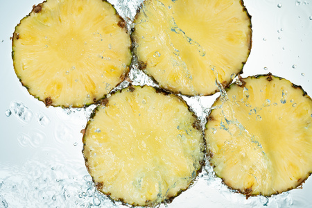 Pineapple Water Splash on White Backgroundの写真素材