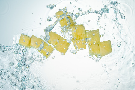 Pineapple Water Splash on White Backgroundの写真素材