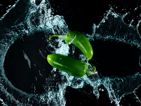 Freeze Motion of Jalapeno Peppers with Water Splashの写真素材