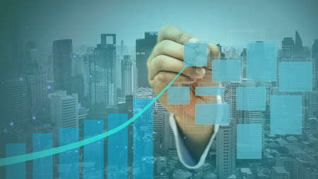 Businessman holding a touch pen Top line graphの写真素材