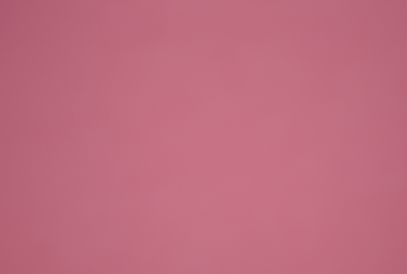 Sheet of pink catrdboward with smooth surface.ieadl for background and artistic work.Horizontal view.の写真素材