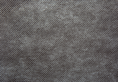 A sheet of thick, coarsely woven fabric in dark grey colour.Texture and background.Horizontal view.の写真素材