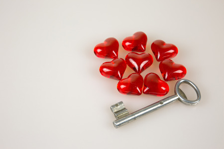 Eight,Valentine's Day, small red hearts and key ion solated white background.Horizontal view.の写真素材