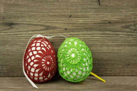 Two large eggs on old wooden table. Close horizontal view.
