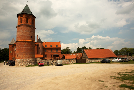 View of gothic castle in Tykocin located on the right bank of Narew river, Poland in beautiful sunny summer day. Editorial.Horizontal view.のeditorial素材