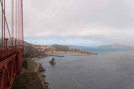 San Francisco, California-USA, August 2016: Side view of the Golden Gate Bridge, cliff coast, the bay, and the island's second edge.Editorial.Horizontal view.のeditorial素材