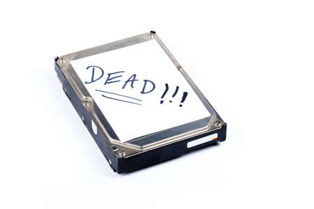 Dead defective silver metal 3.5 inch thick hard drive storage with a white text label isolated on...