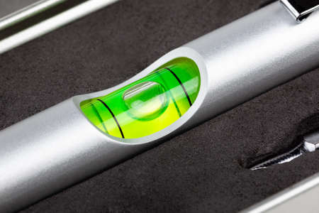 Small mini spirit level, green bulls eye extreme closeup macro silver pocket measuring tool,...