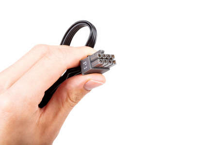 Hand holding up in fingers, presenting one single pc power supply unit black P1 8 eight pin PCI...