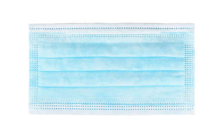 Simple single blue protective face mask, one time use new surgical protection closeup. Object isolated on white background, cut out, top view, laying flatの写真素材