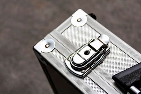 Silver metal suitcase, box, crate or simple case with a handle for equipment, valuables or money...