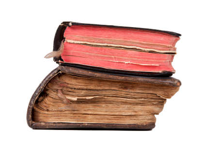 Two old severely damaged books isolated on white