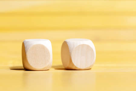 Two simple blank wooden dice, pair of plain cubes with logo or icon space, double cube mockup design...