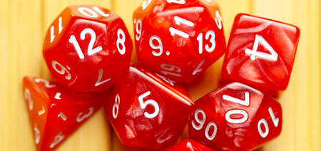 Lots of red RPG game dice extreme closeup wide shot, banner. Role playing board games symbol, simple...