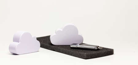 Cloud data storage solution model, cloud remote server file storing, sharing, internet drive storage technology solutions symbol, abstract concept White cloud props and an usb flash drive infographicの写真素材