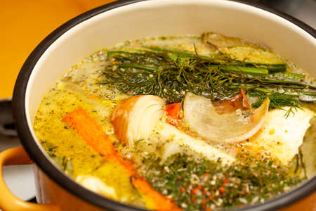 Broth, traditional polish rosÃ³Å, tasty home made rosol chicken soup cooking in a large pot, surface closeup, detail, dish preparation. Fresh vegetables in meat soup, polish cuisine concept, nobodyの写真素材
